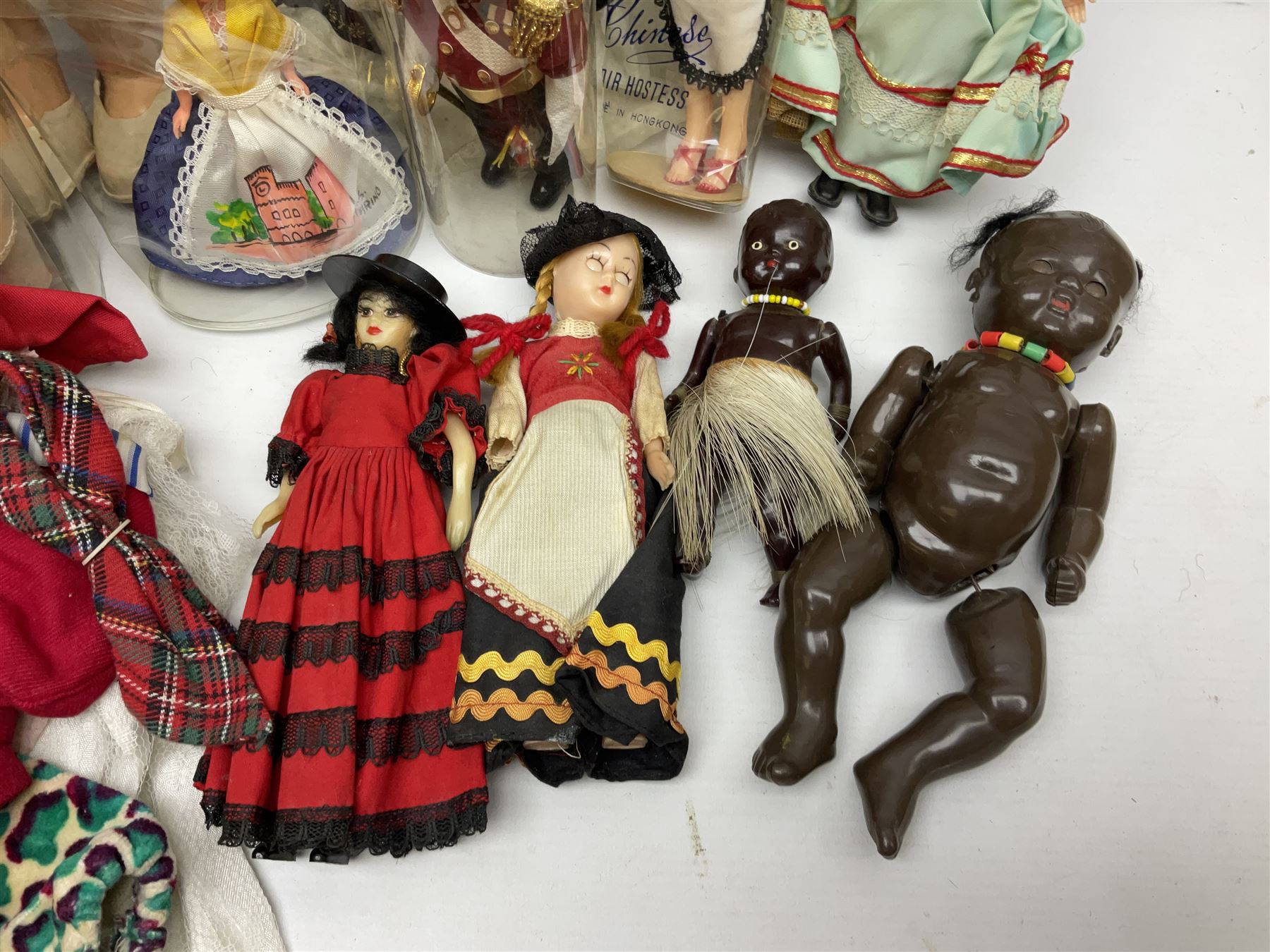 1960s Pedigree hard plastic walking doll H41cm; two fashion dolls; quantity of doll's clothing by Faerie Glen, Pedigree etc; and small collection of National Costume dolls; together with Dinky die-case army truck