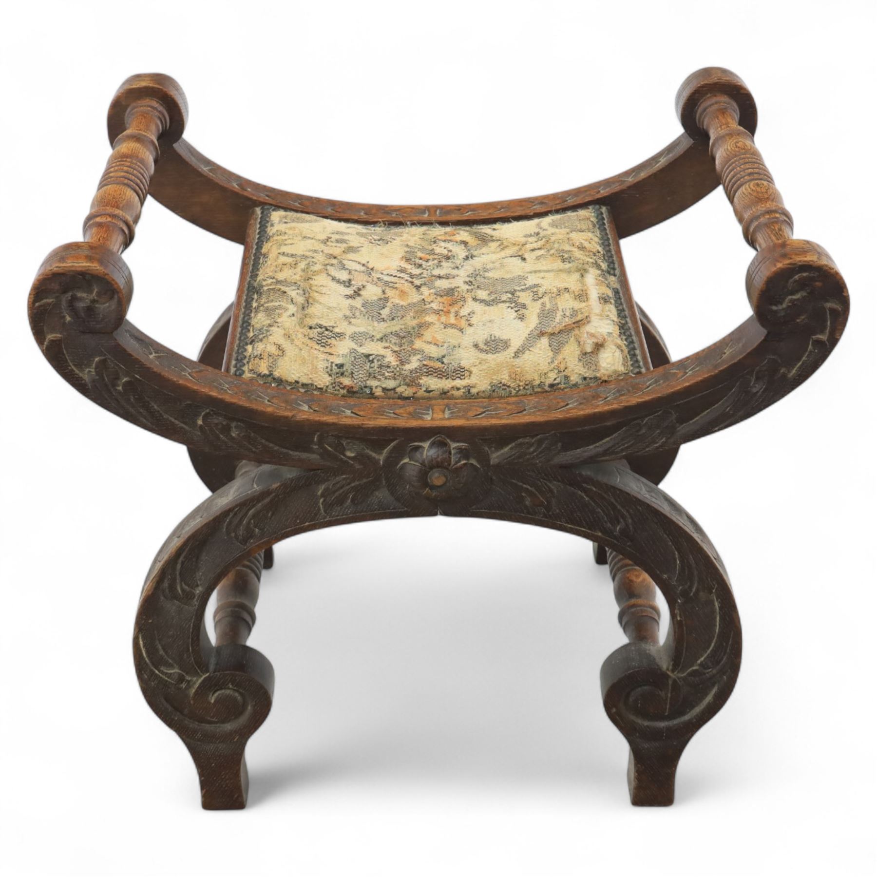 Late 19th century carved oak X-frame stool with tapestry seat
