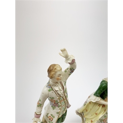 A pair of Sitzendorf figures, modelled as a male and female figure in eighteenth century dress with sheep beside feet, each upon gilt detailed circular base, each with printed mark beneath, tallest H18.5cm, together with a Volkstedt figure modelled as a Eastern female figure with camel seated at her feet, with printed mark beneath, a Sitzendorf figure of a young male figure, a figure modelled as a seated female playing the lute, with dog seated upon her lap, and a figure group marked foreign. (6). 