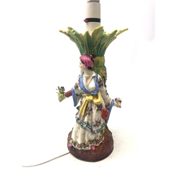  Late 19th century Continental porcelain figure group, modelled as a lady and young child each in oriental style dress either side of a palm tree (converted from a table centre piece to table lamp, H29cm   