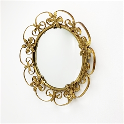 An Antique style mirror, or circular form with foliate detail, D51cm, together with another Vintage style mirror, of circular form with scroll and foliate surround, D41cm. 