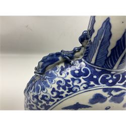 19th century Chinese blue and white moon flask vase, the central panel depicting musicians, bordered by floral, foliate and scroll decoration, with lizard handles to each shoulder, upon an oval foot, H31cm 