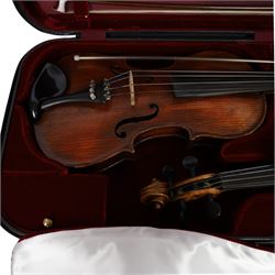 Two 19th century violins, each with two piece maple backs, ebonised wooden pegs and finger boards and modern plastic chin rests, with two bows, all contained within a modern two-violin soft case with red interior