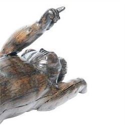 17th century carved figure of a putto, modelled with arms upstretched and head turned, approximately H64cm W23cm D27cm