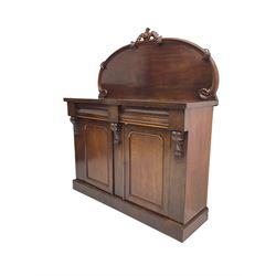 Victorian mahogany chiffonier sideboard, raised back with central cartouche pediment, fitted with two two drawers over two panelled cupboards, flanked by foliate corbels