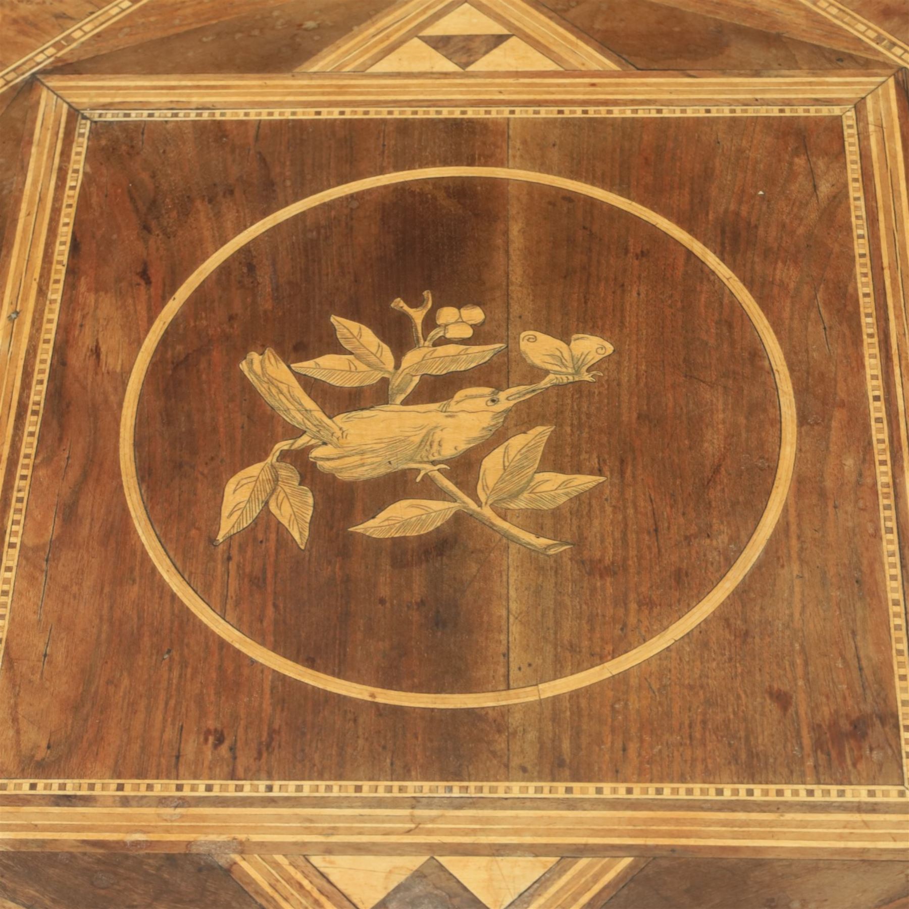 Mid-20th century Italian marquetry inlaid walnut centre table, octagonal top decorated with radiating panels and central foliate roundel, crossbanded borders with line inlay, raised on turned column and tripod base
