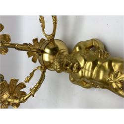 Pair of 19th century and later ormolu wall sconces, each modelled as an Atlas figure stood upon a curved bracket with acanthus support, supporting a plain globe with three scrolling branches with beaded sockets above foliate drip pans, and further conforming socket and drip pan, H67cm