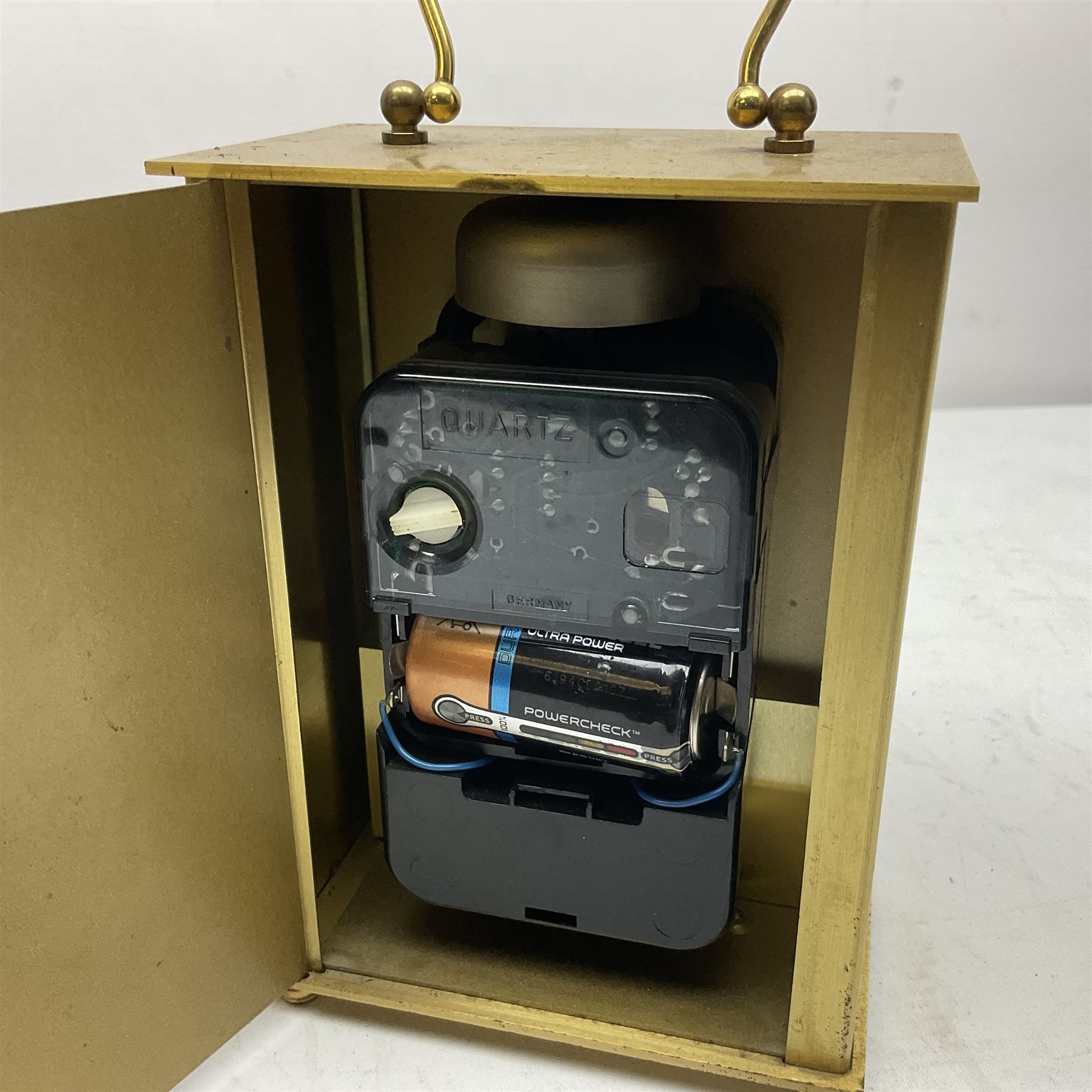 Avia Quartz mantle clock, a London alarm clock and a collection of coins