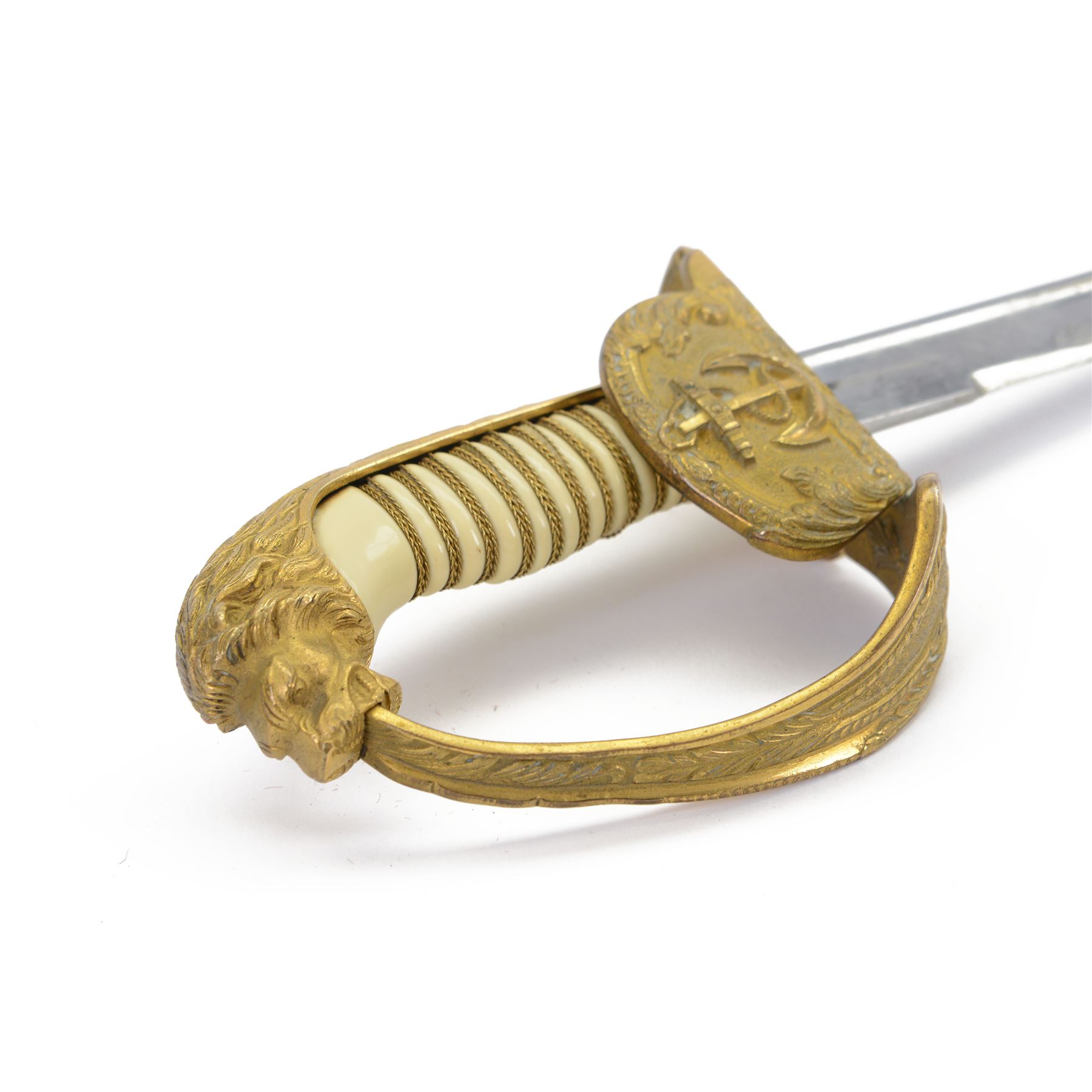 WWII German Kriegsmarine naval officers sword, the 79cm single edged blade marked Carl Eickhorn Solingen, brass hilt with anchor to folding guard, lion mask pommel, wirebound cream plastic ivorine grip, with leather scabbard with brass-mounted and single suspension ring, sword and scabbard marked 0.1735, overall L96cm  