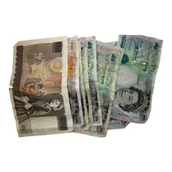 Coins and banknotes, including Bank of England Gill ten pound note 'HN21', seven Kentfield five pound notes, Kentfield ten pounds 'JK20' and a small number of Queen Elizabeth II coins