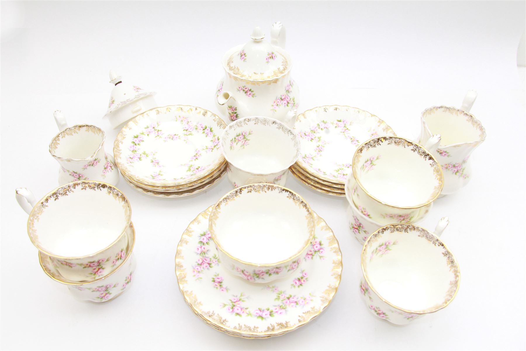 Royal Albert Dimity Rose pattern tea service for six place settings, including teapot, teacups and saucers, sugar bowl and two milk jugs, all with printed mark beneath