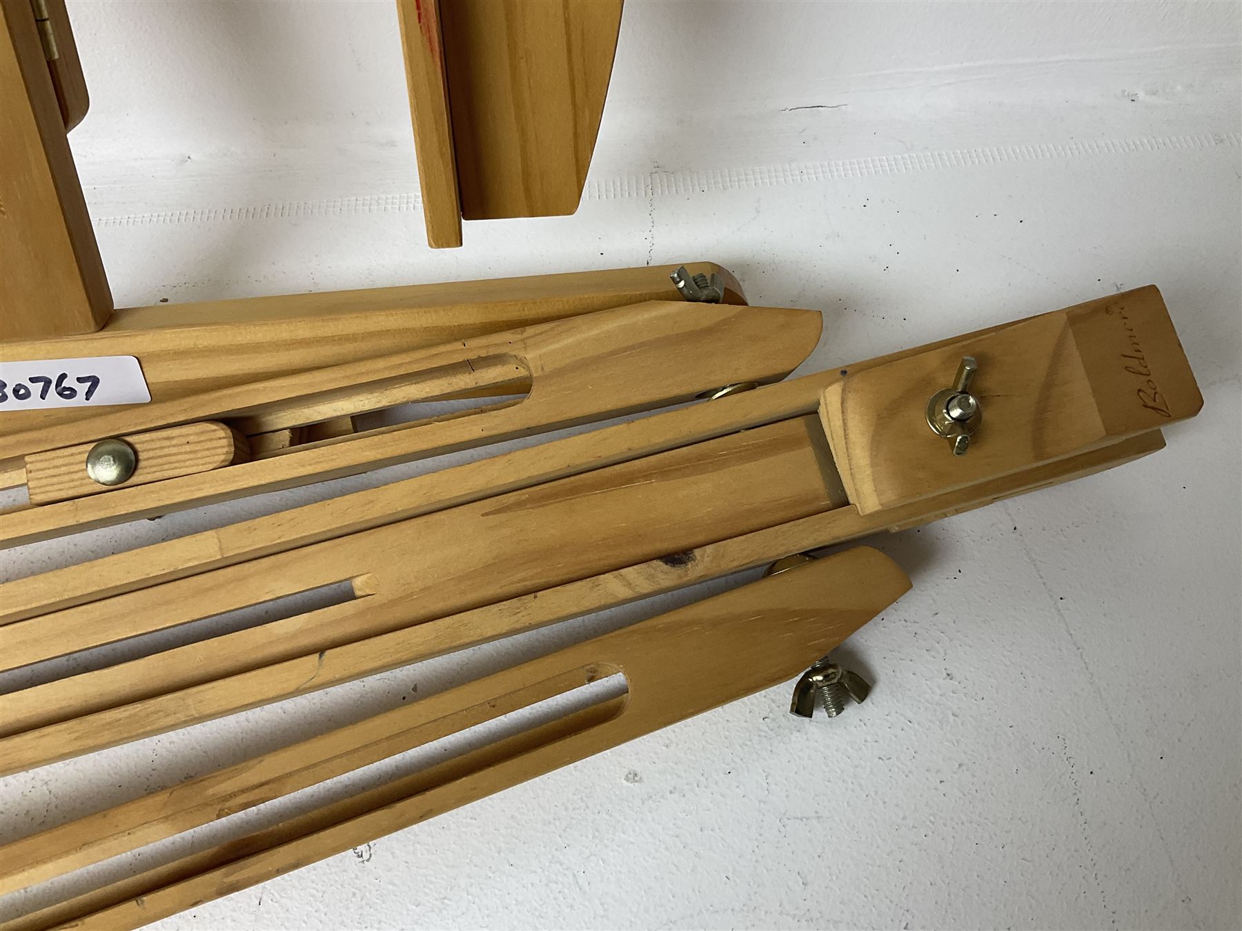 Boldmere wooden artists easel, together with a similar wooden easel by Artistik and Aboriginal artwork on fabric, tallest easel H143cm