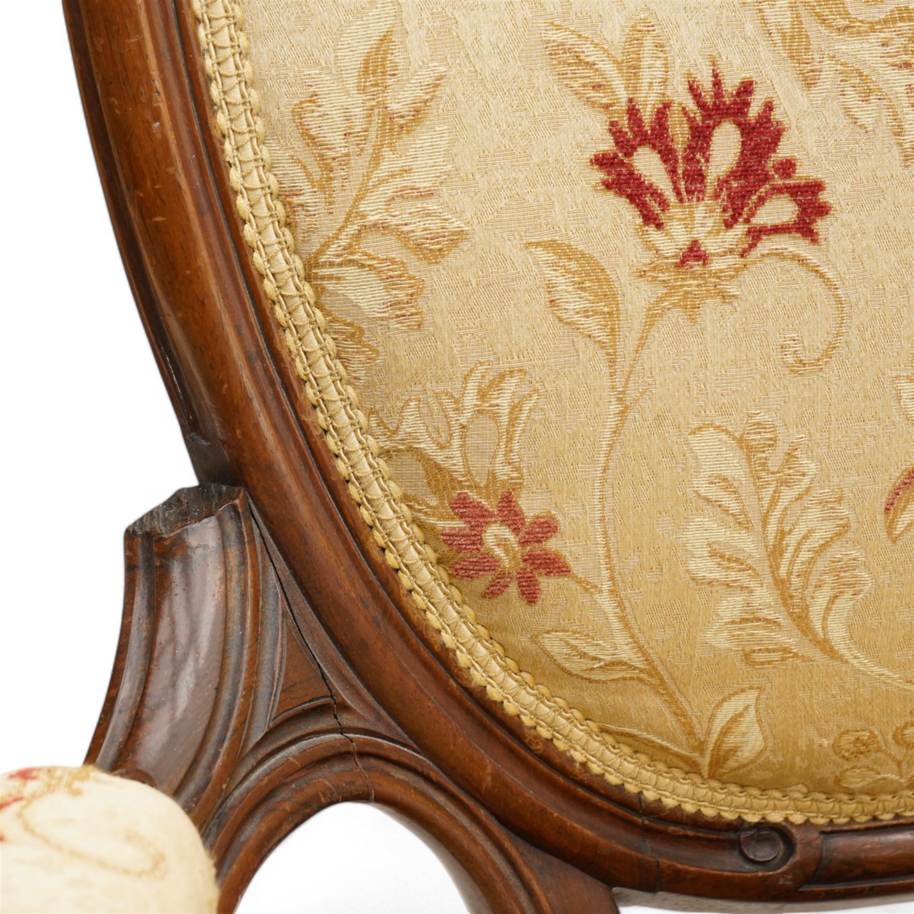 Victorian Ladies and Gentleman's carved walnut drawing room chairs, each with shaped cresting rail carved with scrolls and flowerheads, upholstered in pale gold floral fabric, raised on foliate-carved cabriole supports terminating to brass and ceramic castors
