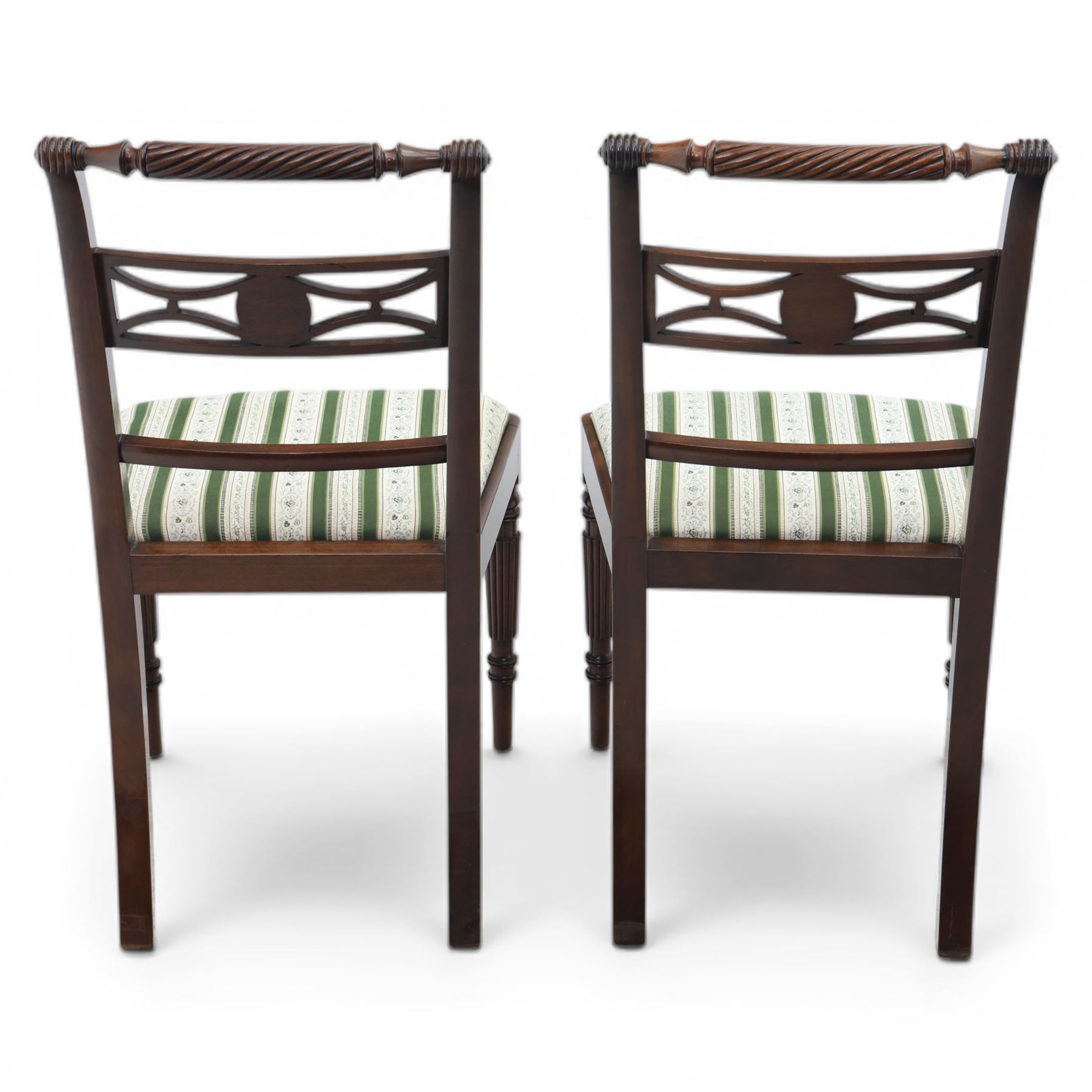 Pair of 19th century mahogany dining chairs, the wrythen top rail above a pierced splat and reeded side supports, above a white and green upholstered drop in seat, upon turned and reeded front and plain back legs