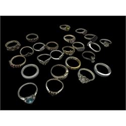 Twenty-four silver stone set ring including tanzanite, garnet, topaz amethyst and cubic zirconia, stamped