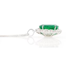 18ct white gold emerald and diamond pendant necklace, single oval cut  emerald of approx 3.25 carat, surrounded by fourteen round brilliant cut diamonds, on a fine link chain necklace, hallmarked, total diamond weight approx 0.50 carat