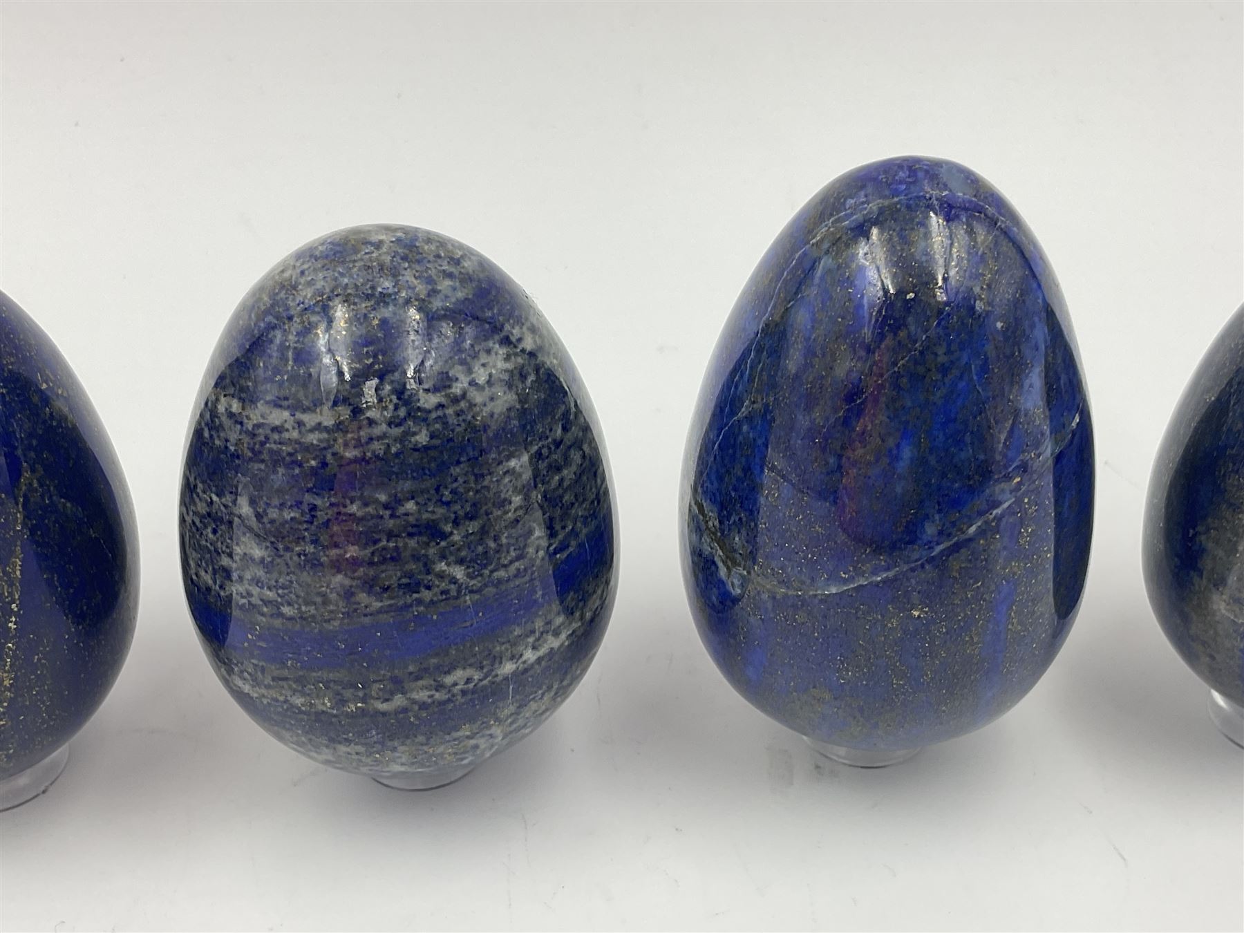 Collection of five Lapis lazuli specimen eggs, largest egg H7cm