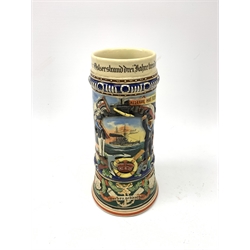 Early 20th century German reservists one litre ceramic beerstein of Naval interest with all over moulded and printed decoration and German text including SMS Schlesien Kiel 1911-14 Reserve Hat Ruh etc H24cm