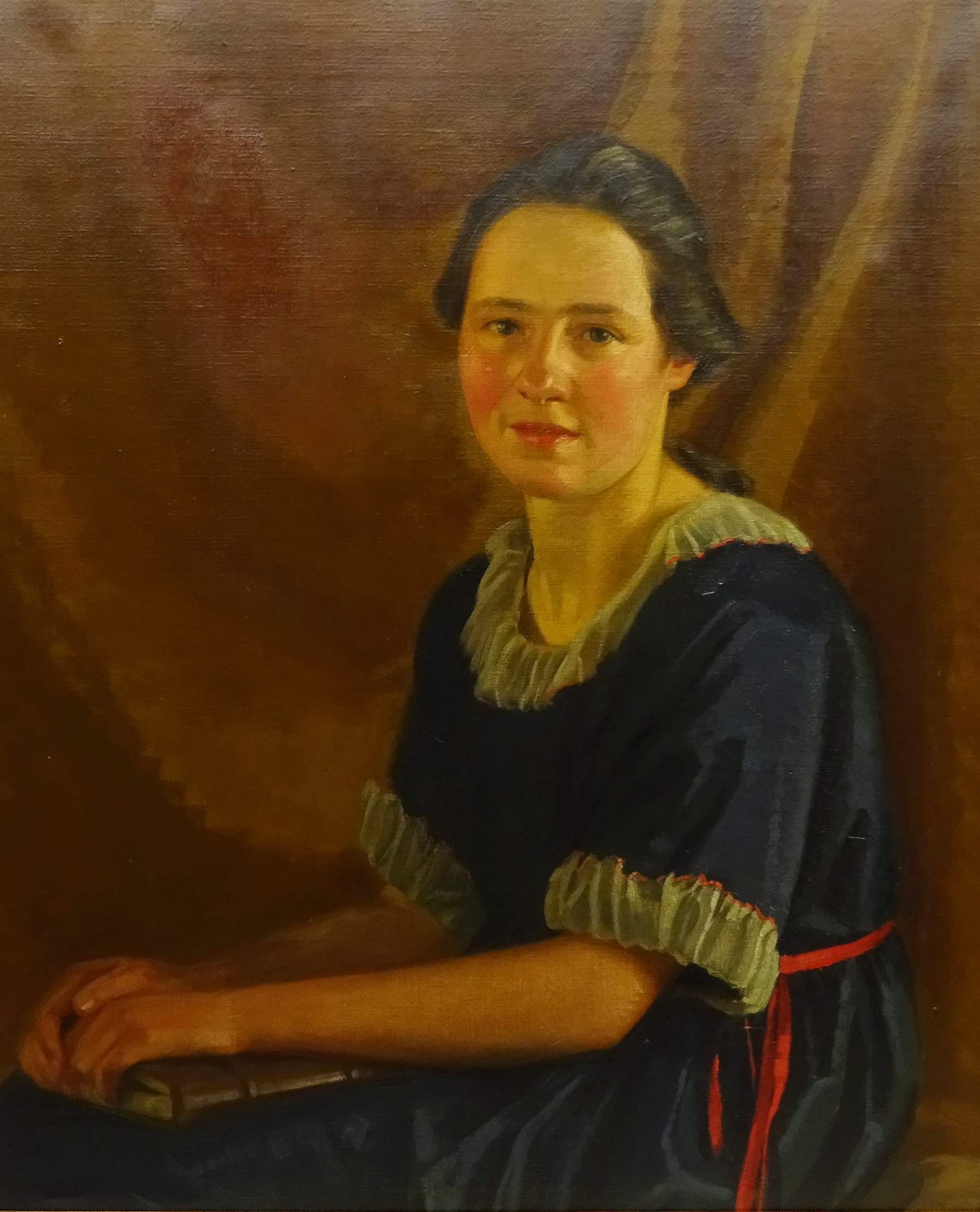 James P Barraclough (British 1891-1942): Half Length Portrait of a Young Woman in a Blue Dress, oil on canvas signed 75cm x 62cm 
Provenance: by direct descent through the artist's family