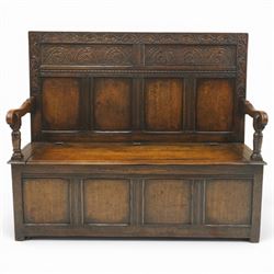 Victorian Jacobean Revival carved oak settle or hall bench with box seat, the cresting rai...