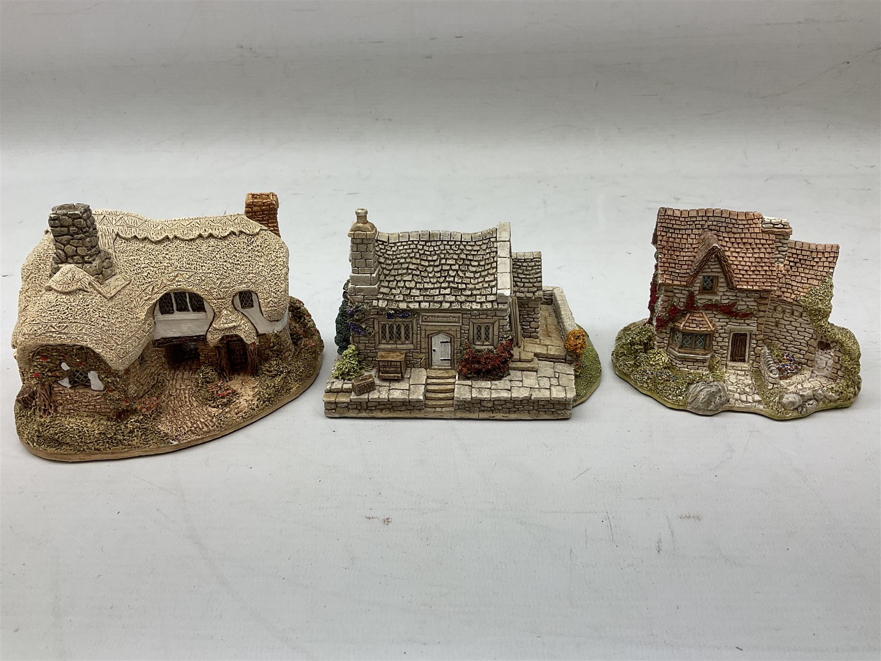 Twenty six Lilliput Lane models from the British and English Collections to include 'Ostlers Keep', 'Holme Dyke', 'Dovetails', 'Victoria cottage' etc, all boxed with deeds