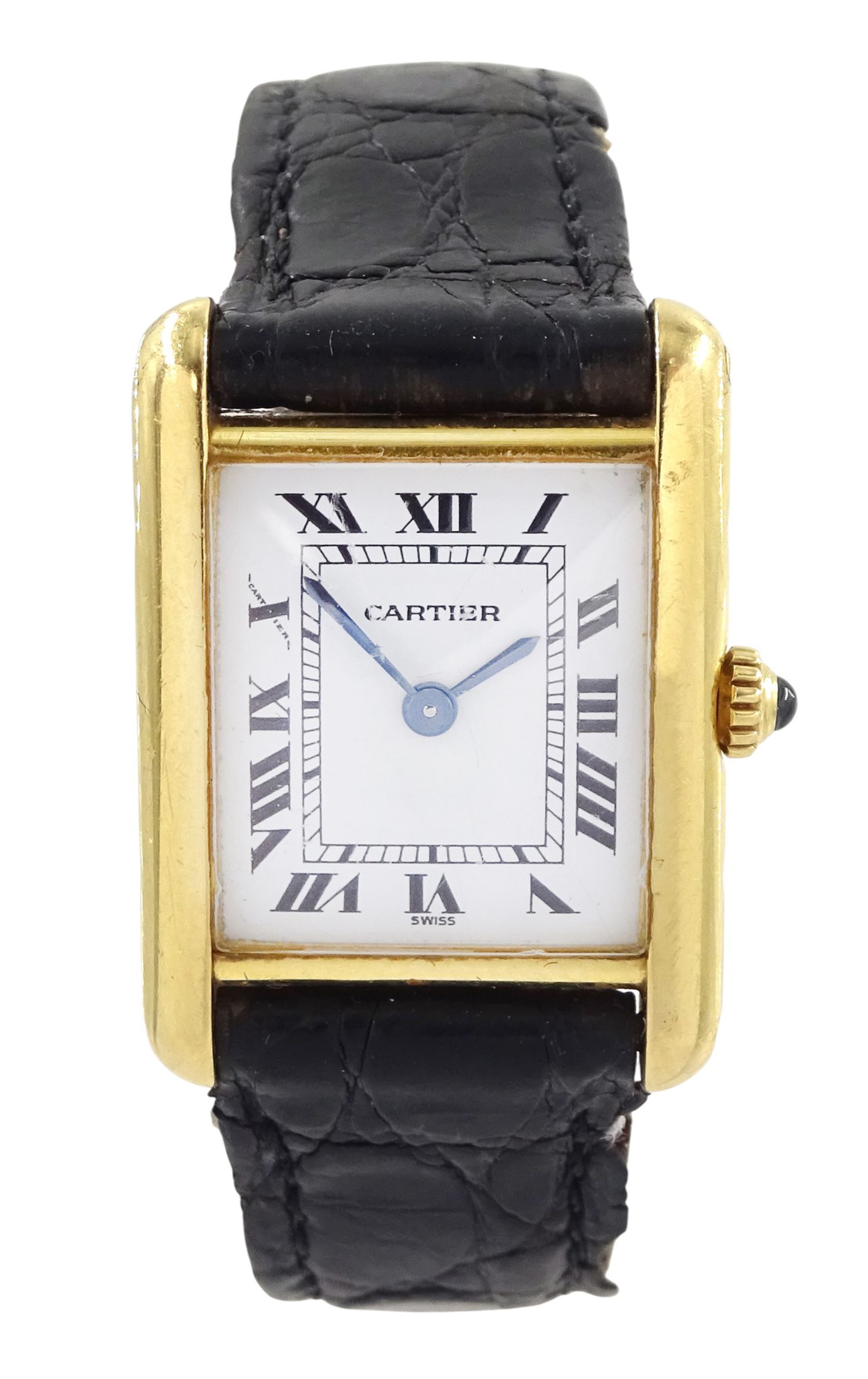 Cartier Tank ladies 18ct gold quartz wristwatch, back case No. M 21001496, white dial with Roman numeral hour markers, on black leather strap with 18ct gold buckle, both by Cartier, hallmarked