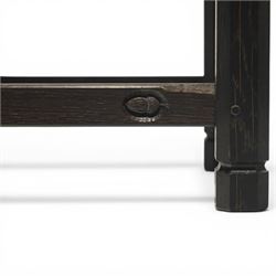 Acornman - dark stained oak stool with upholstered seat, rectangular top with tan leather seat with studded trim, raised on octagonal supports, with carved acorn signature, by the workshop of Alan Grainger of Brandsby