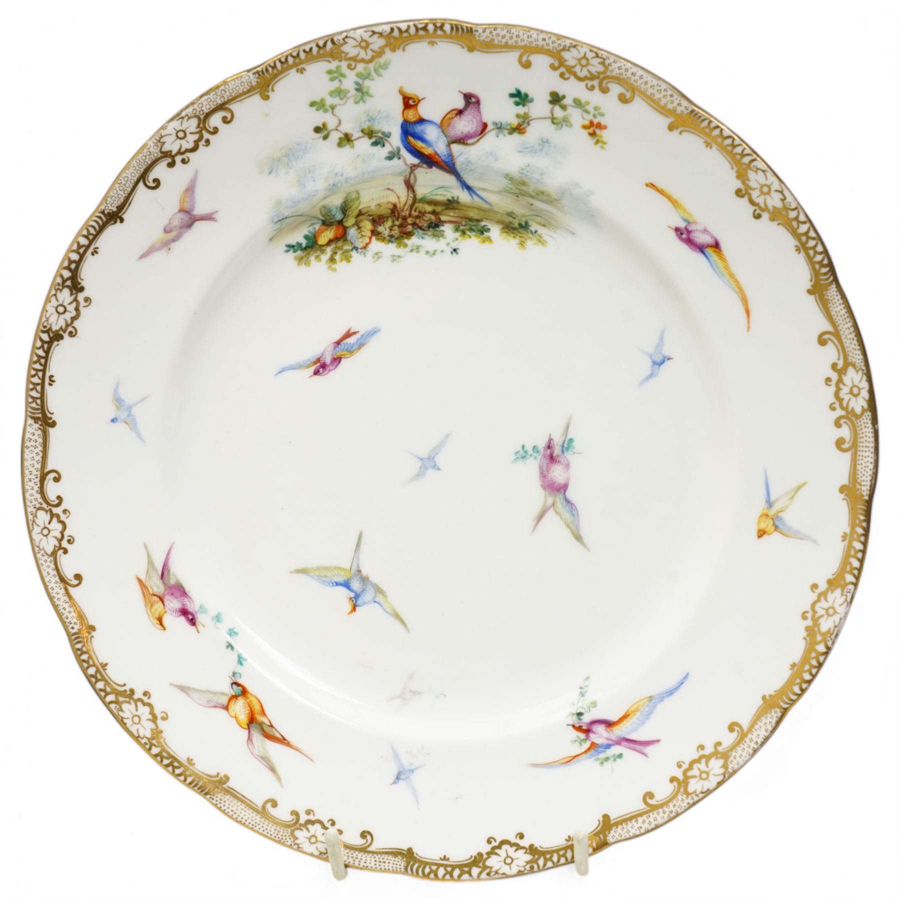 Pair of Coalport cabinet plates, c1850, painted by John Randall with various exotic birds in flight within gilt trailing foliate boarders, D23cm 
