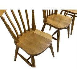 Four beech farmhouse chairs, on turned supports joined by turned stretchers