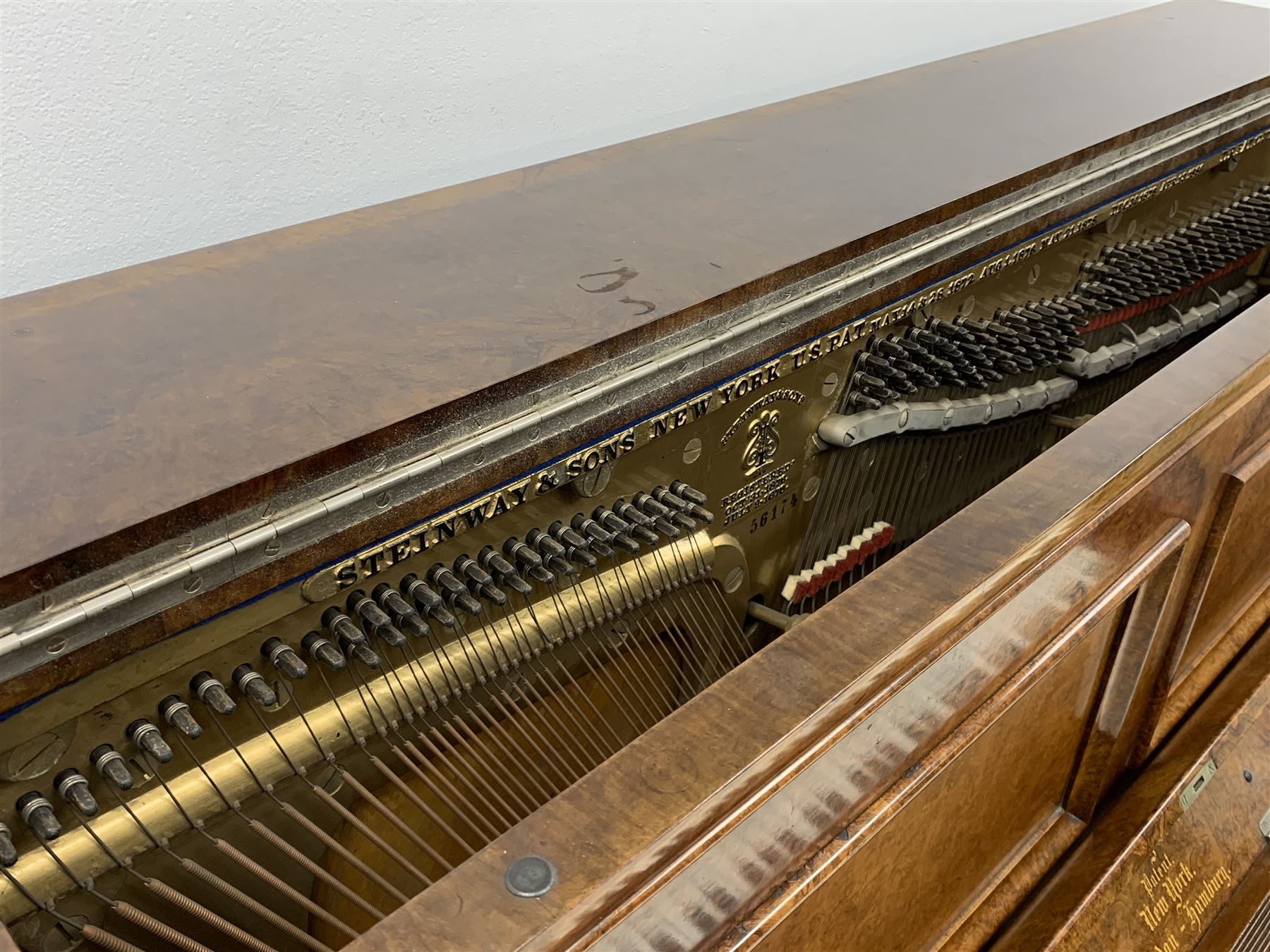 Steinway & Sons - late 19th century figured walnut upright piano, iron framed and overstrung, model no. 56174 circa. 1886, W154cm, H137cm, D70cm, together with a quantity of sheet music