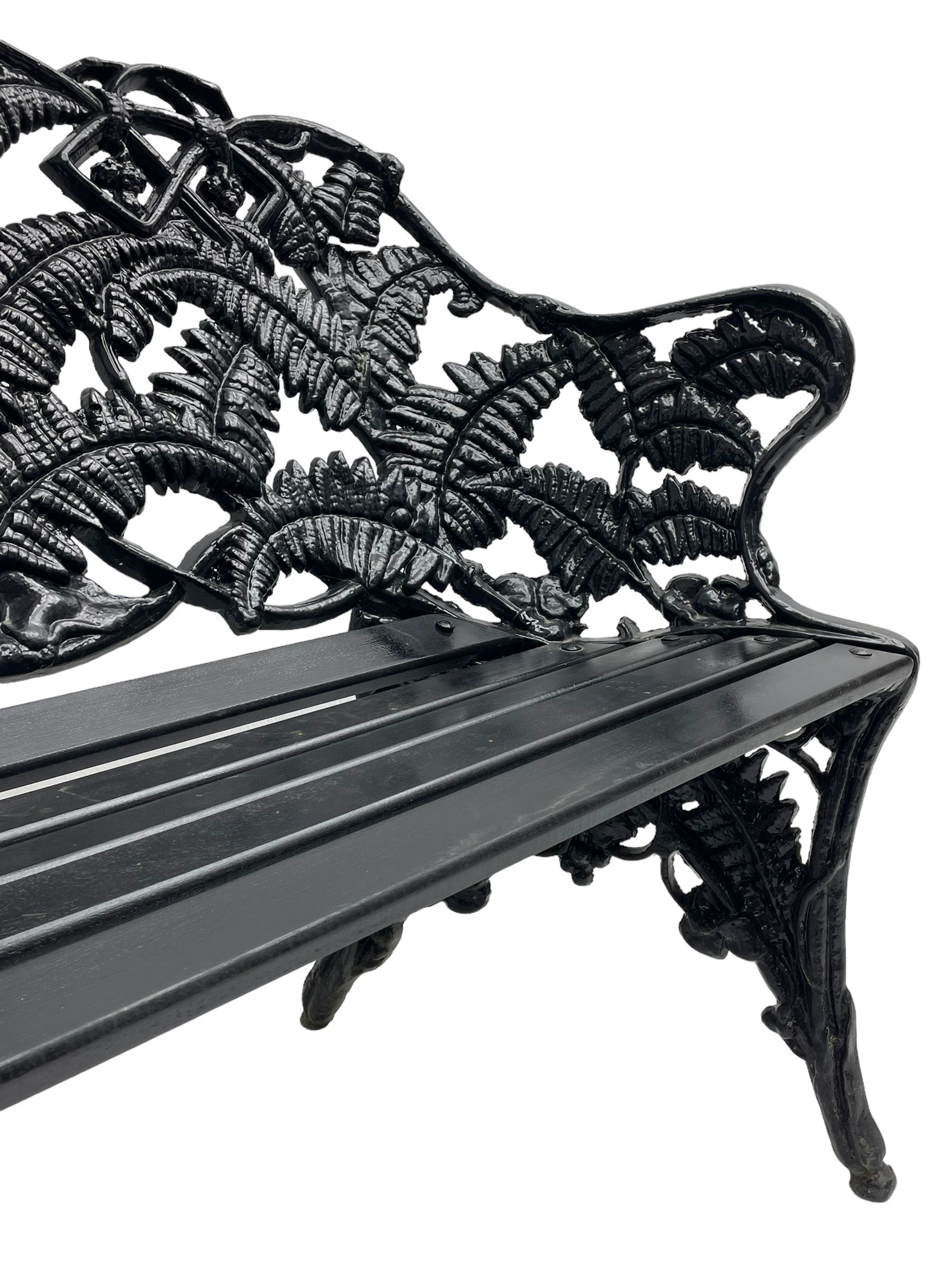 Coalbrookdale - black painted cast iron 'fern' pattern garden bench, decorated with trailing fern leaves, mahogany slatted seat