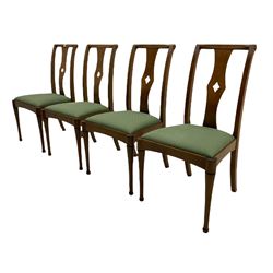 Set of eight contemporary walnut dining chairs, curved backs set with shaped splats with pierced detail, drop in upholstered seat cushions, on turned supports 