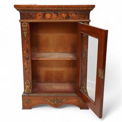 Victorian walnut and gilt metal mounted pier cabinet, rectangular top over acanthus leaf moulded gilt metal edging and floral inlaid frieze, single glazed door inlaid with scrolling leafage and flower heads, fitted with single internal shelf, egg and dart moulded lower edge over shaped skirt base 