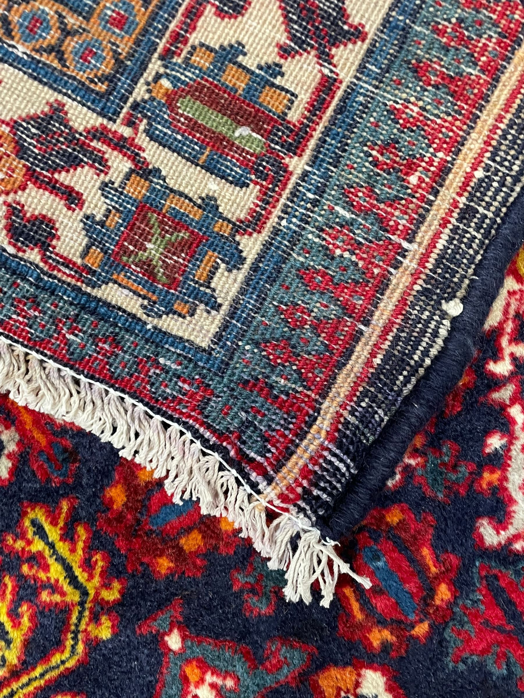 Persian Meimeh indigo ground rug, the central medallion within a field of small floral lozenge motifs, the guarded border with repeating pattern