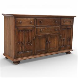 Ercol - elm dresser sideboard, fitted with four drawers and four cupboards with carved det...