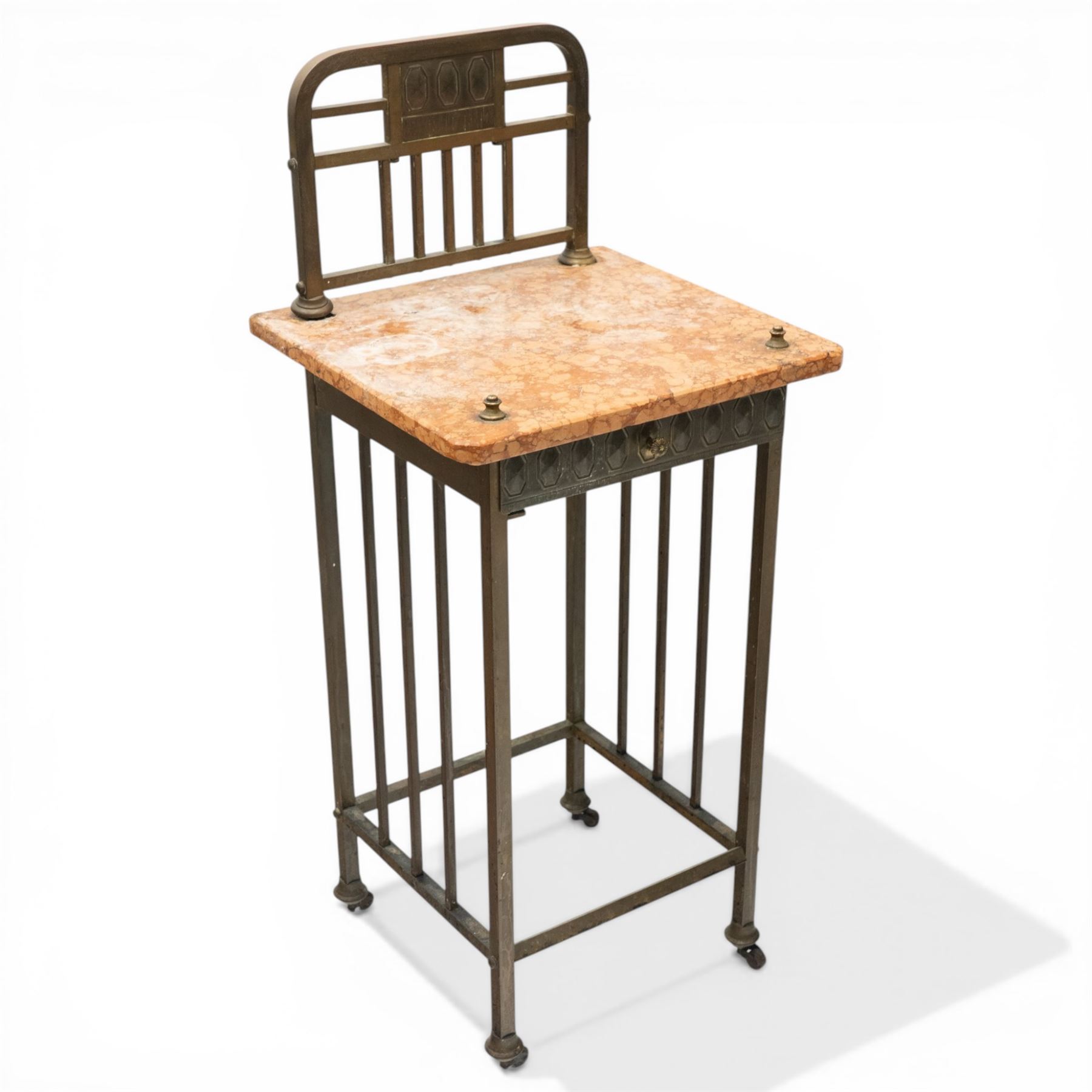 Pair of European Art Deco brass and marble bedside tables, the raised bass back over a canted rectangular marble top, fitted with single drawer decorated with repeating octagonal decoration, raised on square tubular supports with castors, united by undertier