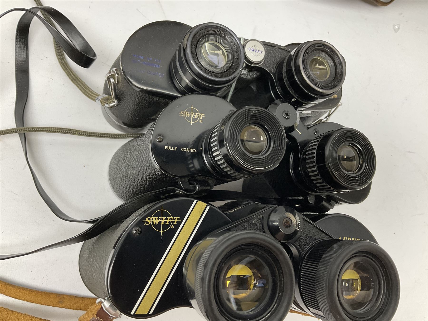 Eleven pairs of Swift binoculars, to include Greens 8x40, Saratoga 8x40, two pairs of Newport Mk II 10x50, Newport 10x50, Saratoga Mk II 8x40, Audubon 8.5x44, etc, 