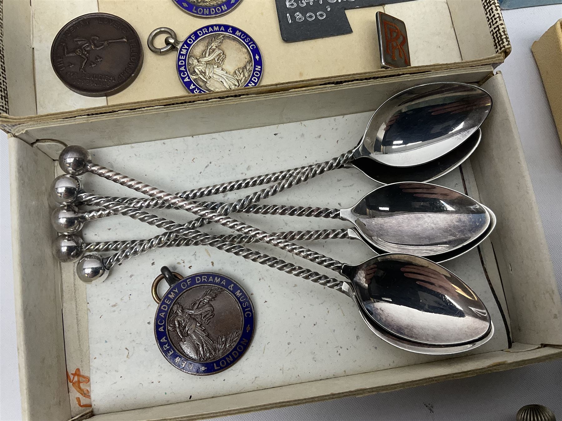 Pair of Georgian silver dress buttons, silver caddy spoon, silver fob medals, silver watches, set of six silver plated teaspoons, set of gilt buttons with ship design, etc