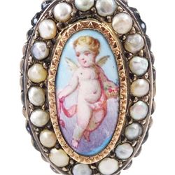 19th century French silver enamel portrait ring, set with an oval hand painted panel of a cherub, with split pearl surround