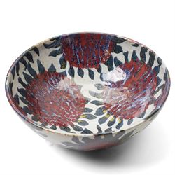 Sophie Hamilton (1963-): Sunflower bowl, decorated with blue and red sunflowers on a pale ground, unmarked, D34cm