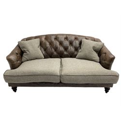 Tetrad - 'Dalmore' traditional shaped two seat sofa, upholstered in buttoned brown leather with contrasting wool seat cushions, together with scatter cushions, on turned front feet