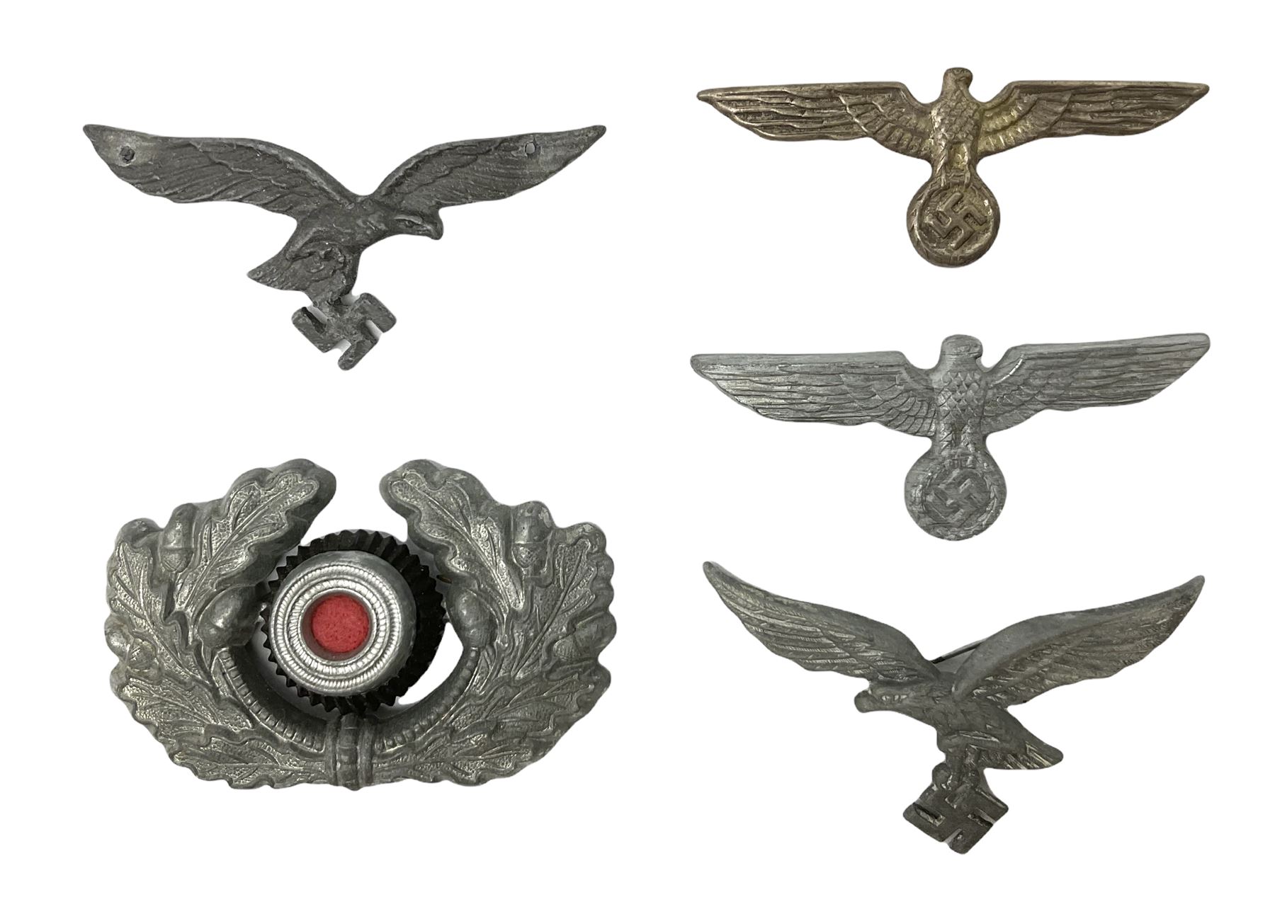 Five WW2 German peaked cap badges, four with double-pinned backs