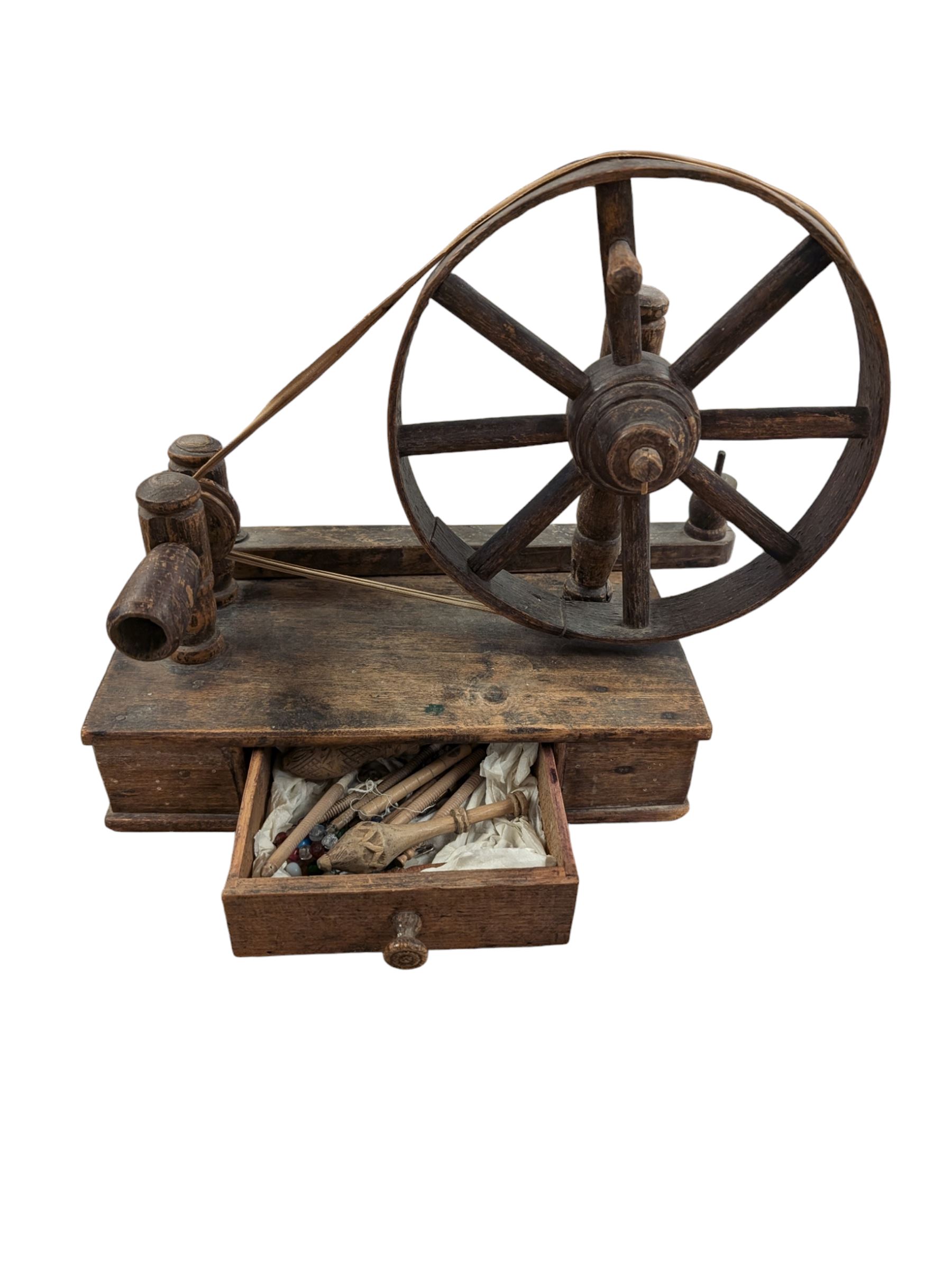 19th century table top spinning wheel, with drawer containing small selection of lace bobbins, H33cm