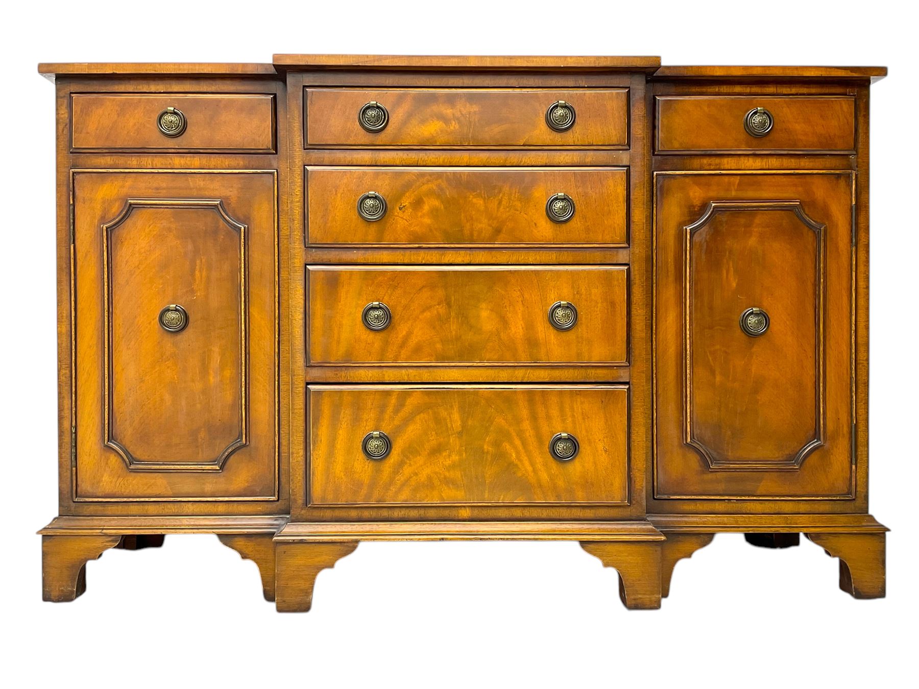 Georgian design mahogany break-front sideboard, fitted with six drawers and two cupboards, on bracket feet 