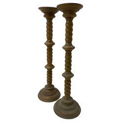 Pair of Victorian design light oak torcheres or jardinieres, circular top with raised lip over a spiral turned column terminating in circular turned plinth base