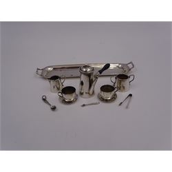 Edwardian miniature silver tea set, comprising hot chocolate pot, two cups and saucers, milk jug, sugar bowl and tray, hallmarked Cornelius Desormeaux Saunders & James Francis Hollings (Frank) Shepherd, Chester & Birmingham 1908, with two spoons and pair sugar tongs, hot water pot H3.8cm