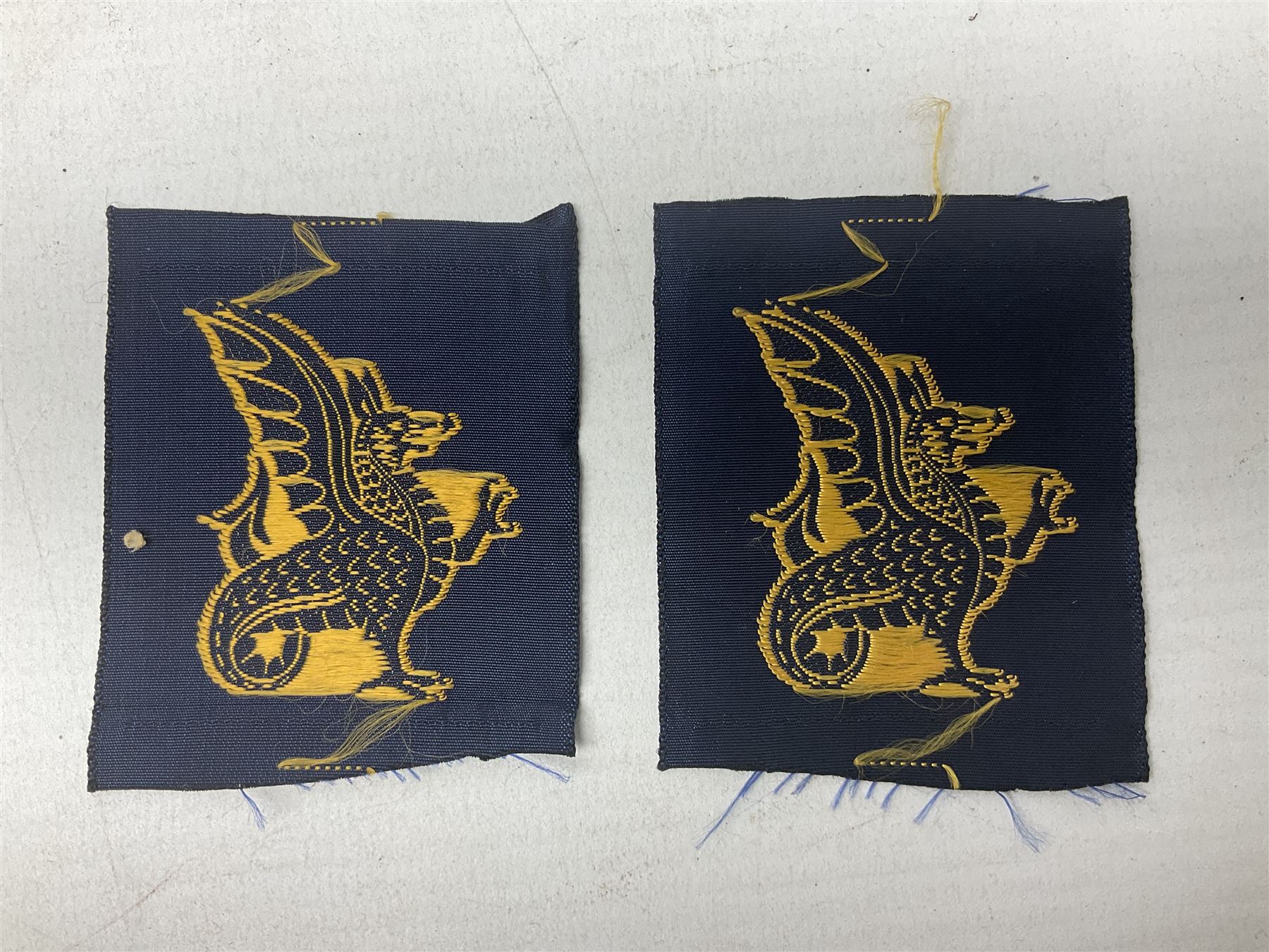 Royal Arms cloth arm adge as worn by Regimental Serjeant-Majors in Foot Guards; naval cap badge; WW2 Commando/Special Forces cloth badges; Home Guard and LDV shoulder titles; and other cloth badges including armoured division, 45th and 77th division, 52nd Lowland Mountain division etc; and 24th Infantry Brigade airmobile pennant