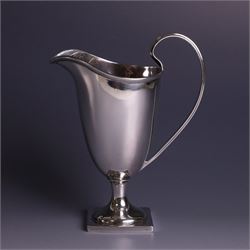 Edwardian silver helmet shaped cream jug, with plain bowl and upon a square base, hallmark...