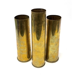 Three early 20th century plain brass shell cases, dated 1911, 1915 and 1916, tallest H35cm (3)