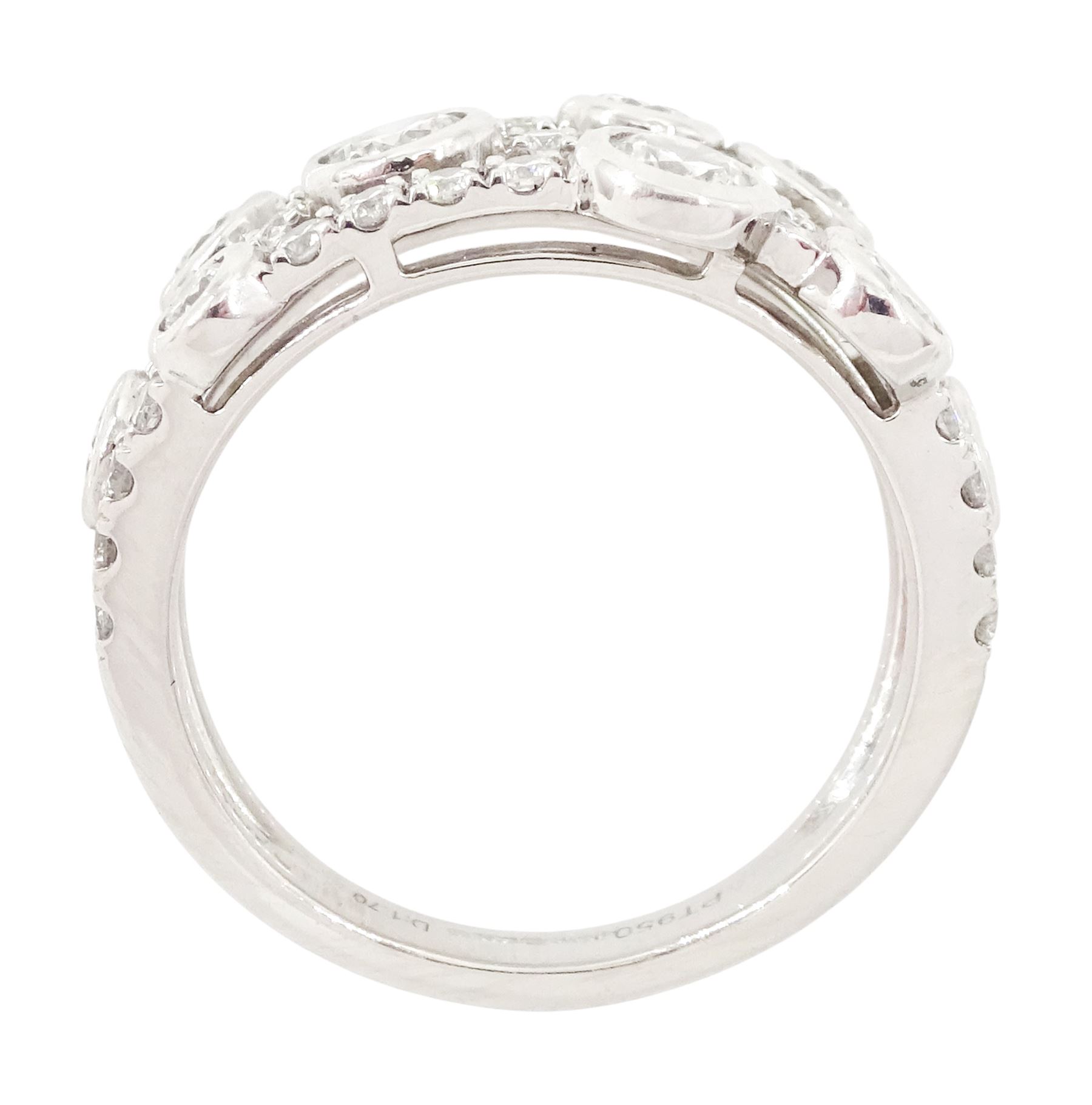 Platinum diamond three row split design ring, nine bezel set round brilliant cut diamonds, spaced by smaller round brilliant cut diamonds, hallmarked, total diamond weight 1.70 carat 